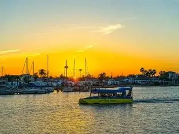 The Duck boat cruising at sunset