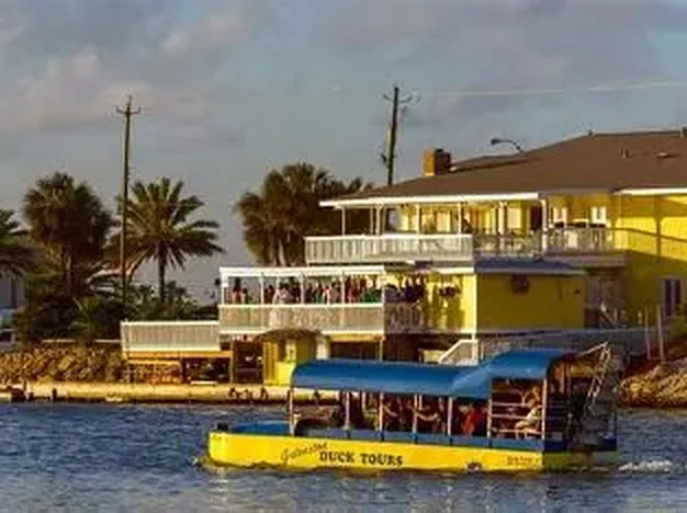 The Duck tour vehicle rolling along a Galveston street